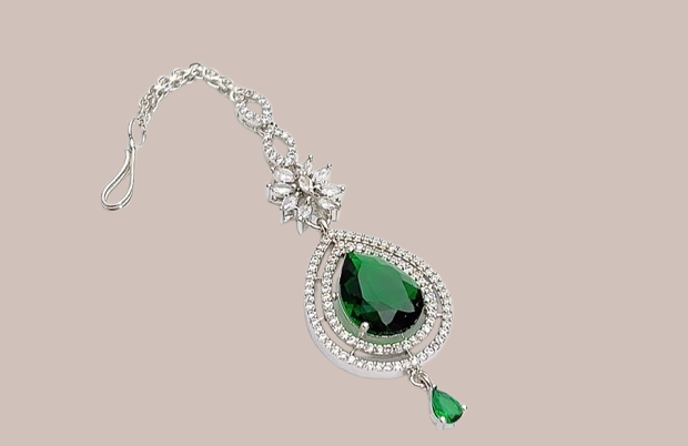 Silver bracelet with green emerald-style stone
